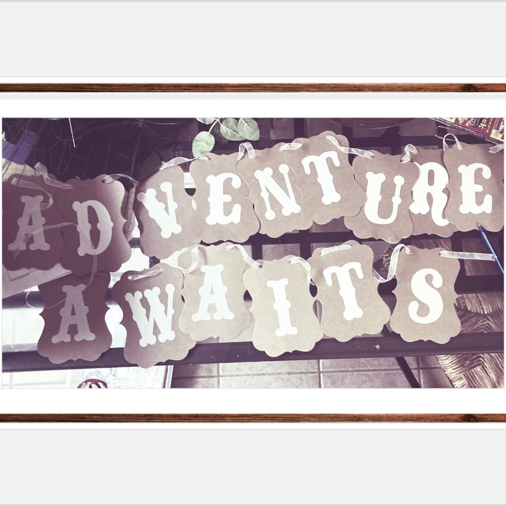 “Adventure Awaits” baby shower sign